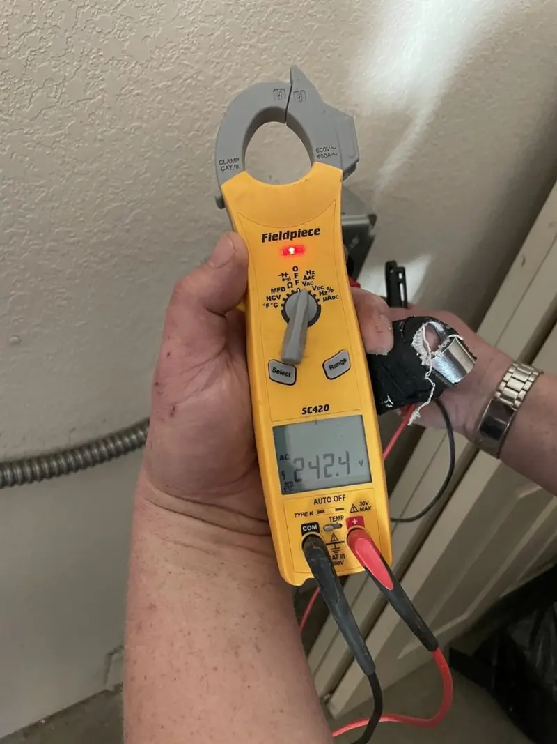 Voltage testing with clamp meter during Recessed Lighting Installation in Pebble Creek